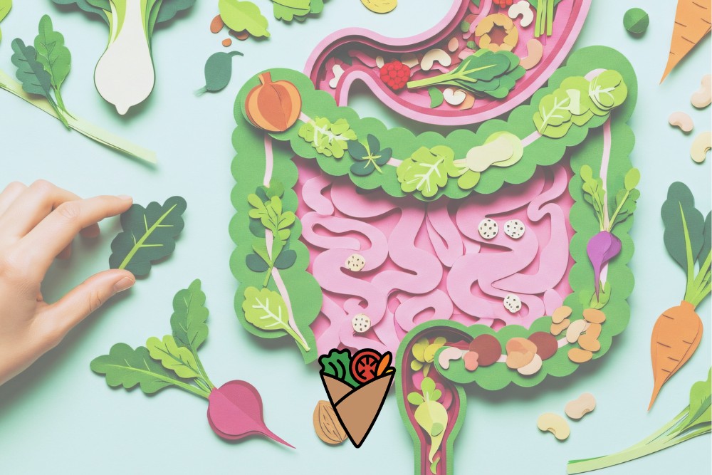 How Science and Nature Power Every Bite-2 A vibrant, colorful paper art image of a digestive system surrounded by fresh produce like carrots and leafy greens, symbolizing healthy living. A hand holds a leaf, emphasizing nourishing, plant-based, allergen-friendly eating with fresh flavors.| Daré Vita Café | Las Vegas